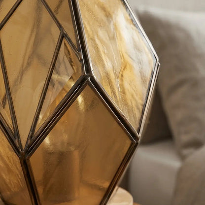 Luce calda diffusa dalla lampada in vetro ambrato